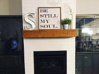 Here is the new fireplace we built with a ventless propane fire place.  This is actually brick looking tile that we painted white.  Mantel is a piece of cedar that we made at the shop.  We hand distressed a new piece of cedar to make it look old.