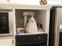 Here is what the kitchen had before for an oven, a conventional electric 24" oven mounted next to the fridge.  Too small for a growing family.