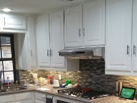 Here is the kitchen after installing a new gas cook top and electric convection oven under the gas cook top.  Also, we changed all the exposed cabinet door hinges to hidden Euro hinges and touched up paint on the doors and cabinets to complete the nice clean look.