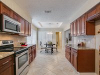 View of the kitchen overlooking the connected breakfest nook.  Note that we repaired and painted the breakfast nook cabinets as a cost savings measure for the client.