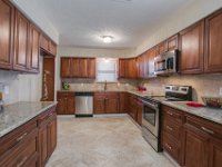 Here is the completely new kitchen!  Flooring, cabinets, counters, backsplash and appliances are all new.